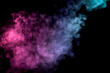 .Colorful blue and pink smoke clouds on dark background.Background of smoke vape