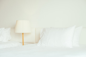 Fototapeta na wymiar White pillow on the bed