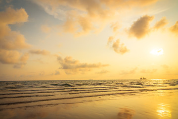Naklejka na ściany i meble Beautiful sunset on the beach and sea