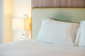 Fototapeta na wymiar White pillow on the bed