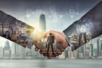 Double exposure of shaking hands of partner which have various group of Multiethnic Business people...