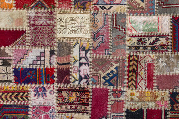 Detail of a old patchwork carpet . Close up - obrazy, fototapety, plakaty
