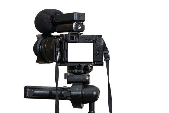 A Professional digital mirrorless camera on tripod with microphone for record on white background, Camera for photographer or Video, Live Streaming equipment concept,  include clipping path