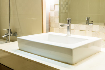 White sink and faucet decoration in bathroom