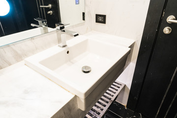 White sink and faucet decoration in bathroom