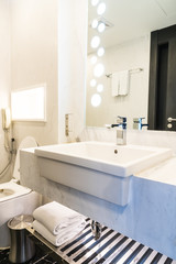 White sink and faucet decoration in bathroom