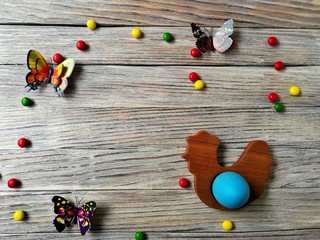multicolored eggs on wooden white background with scuffs  