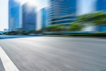 blurred urban road with city skyline background in china.