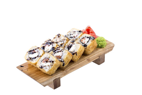 Sushi set on a wooden board on a white background.Isolated.