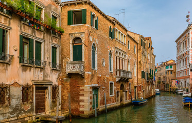 Typical view of the narrow side of a picturesque canal Venice, Italy