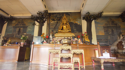 Fototapeta premium Statue of the Buddha god, Sacrifice oblation, traditional offerings for Gods in the Buddhist temple Brahma Vihara Indonesia. Bali Architecture, Ancient design. Travel concept.