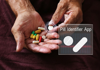Pill Identifier App.An elderly man holding pill in hand , Identification Tool.