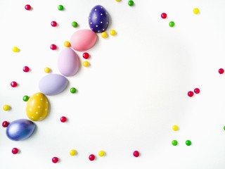 colored eggs on a textured white background  