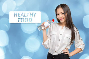 young woman showing a bottle of water