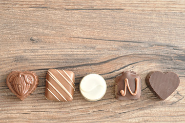 A variety of small chocolates in a row