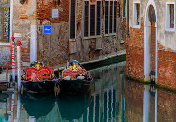 Gondola in picturesque canal in Venice Italy