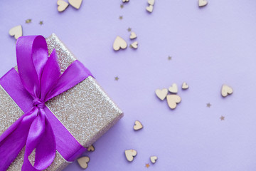 gift box on a violet background. Space for text, top view. Writing romantic letters.