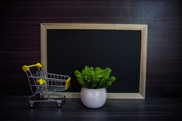 Red clock ,cute toy and Empty blackboard for copy space area