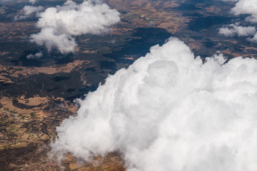 White Cumulus Clouds seen from Window of Airplane © jjfarq