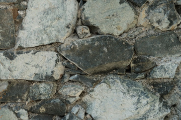 Granite texture, stone wall surface closeup