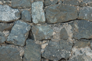 Aged stone, old bricks texture closeup