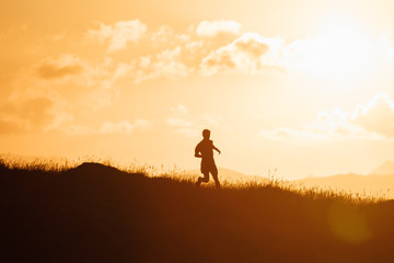 Runner Silhouetted during Sunset