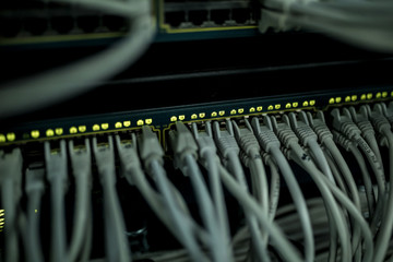 Close up of cables in rack in server room