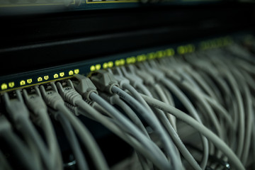 Close up of cables in rack in server room