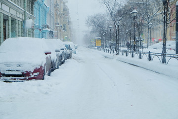 snowfall on the roads of the modern big city
