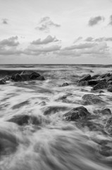 Fototapeta na wymiar Sea waves lash line impact rock on the beach