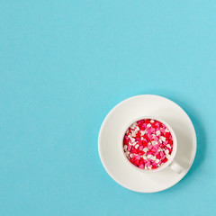 Coffee cup with colorful hearts