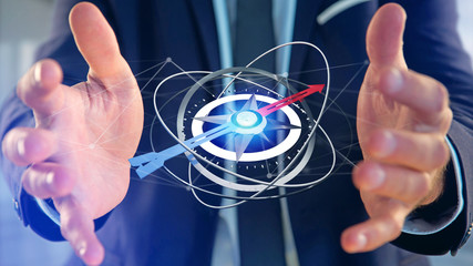 Business man holding a navigation compass - 3d rendered