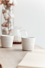 Cup of coffee, branch of tree, wooden windowsill