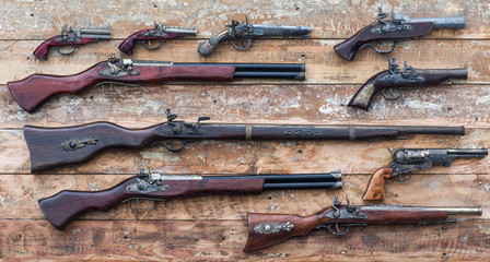 ancient rifle on a wooden table