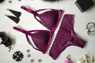 Sexy burgundy lingerie set on the white backhround. Fasion women accessories with vinous underwear
