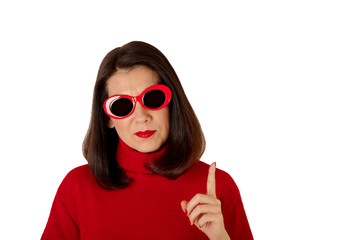 Young woman in red turtleneck and sunny red glasses on isolated background.
