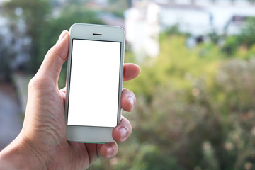 Man Holding a Smartphone on the Outdoor Terrace.