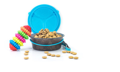 Portable bowls feeding and food with toys isolated on white background.