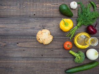 Fresh vegetables, decanter with sunflower oil and bread on the table