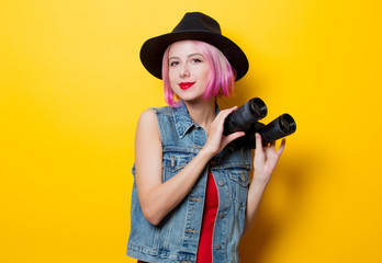 hipster girl with pink hair style with binoculars