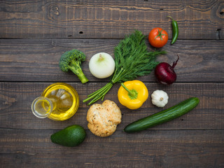 Fresh vegetables, decanter with sunflower oil and bread on the table