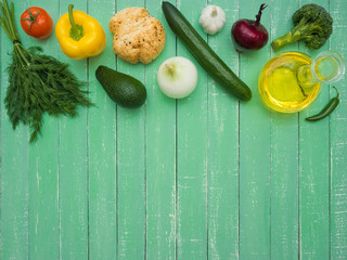Fresh vegetables, decanter with sunflower oil and bread on the table