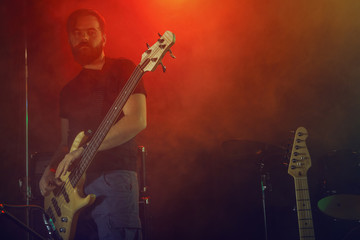 Bass player perform on stage.