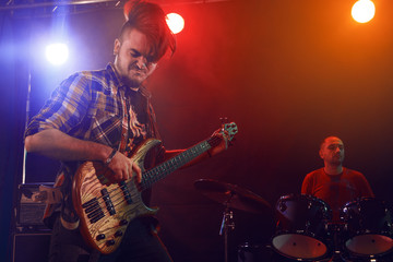 Obraz premium Bass player perform on stage.