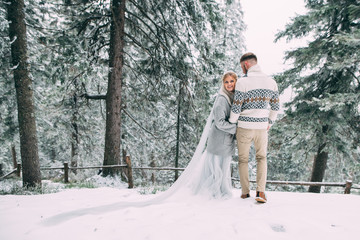 Photo of happy man and woman outdoor in winter