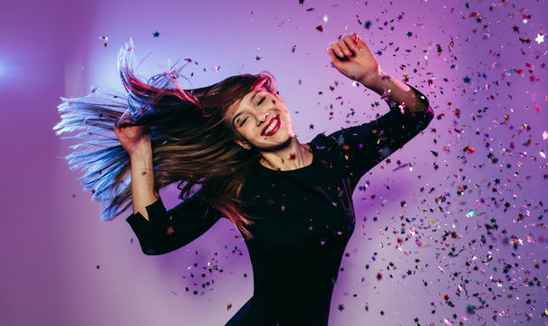 Celebration girl. Portrait of young dancing party girl