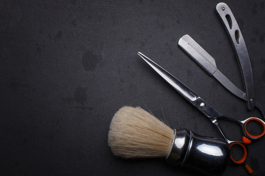 Vintage Tools Of Barber Shop On Black Background