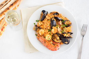 risotto with seafood and tomato, italian food