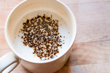 Instant Granulated Coffee Powder with Milk in Cup