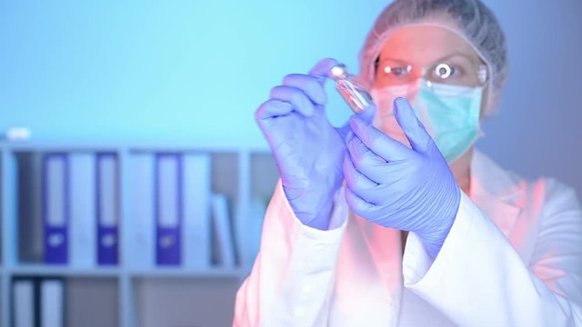 Doctor and nurse analyzing unknown MMR vaccine in medical clinic hospital